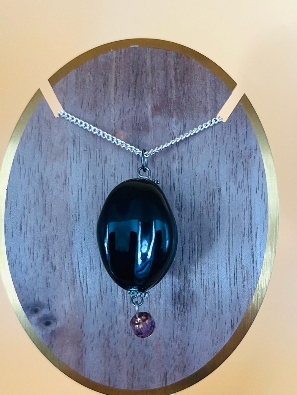 Black Oval Pendant Necklace with Pink Accent Bead